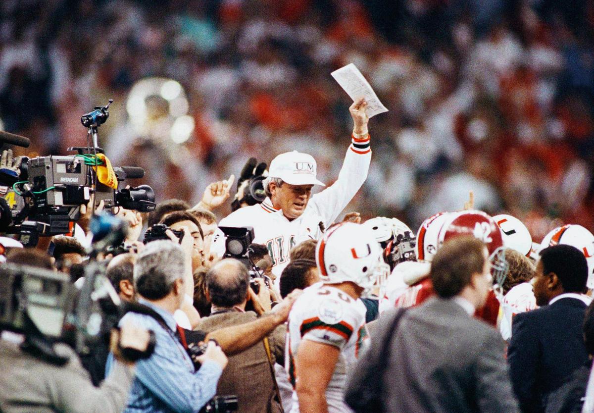 University of Miami football coach Dennis Erickson gets a victory ride at the end of the Sugar Bowl, Monday, Jan. 2, 1990, New Orleans, La. Ericksons Hurricanes defeated the University of Alabama 33-25 for the Sugar Bowl Championship. (AP Photo/Stephan Savoia)