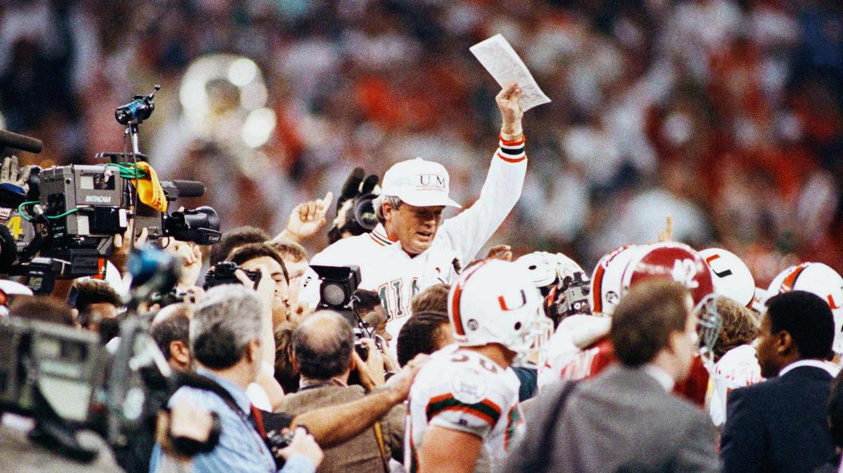 University of Miami football coach Dennis Erickson gets a victory ride at the end of the Sugar Bowl, Monday, Jan. 2, 1990, New Orleans, La. Erickson’s Hurricanes defeated the University of Alabama 33-25 for the Sugar Bowl Championship and eventual national title. (AP Photo/Stephan Savoia)