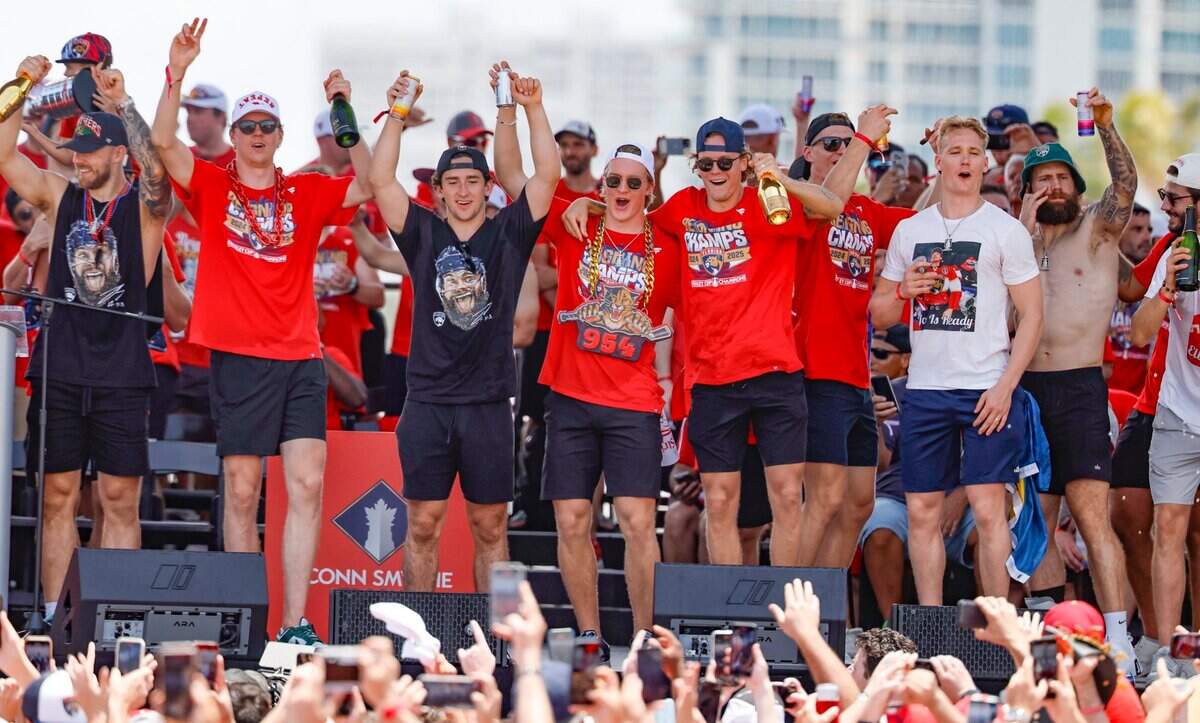 Florida Panthers left wing A.J. Greer , defenseman Niko Mikkola, right wing Mackie Samoskevich , center Anton Lundell (15), center Jesper Boqvist, and defenseman Gustav Forsling celebrate on stage during the Panthers’ Stanley Cup victory parade and rally along A1A in Fort Lauderdale, Florida, on Sunday, June 22, 2025.