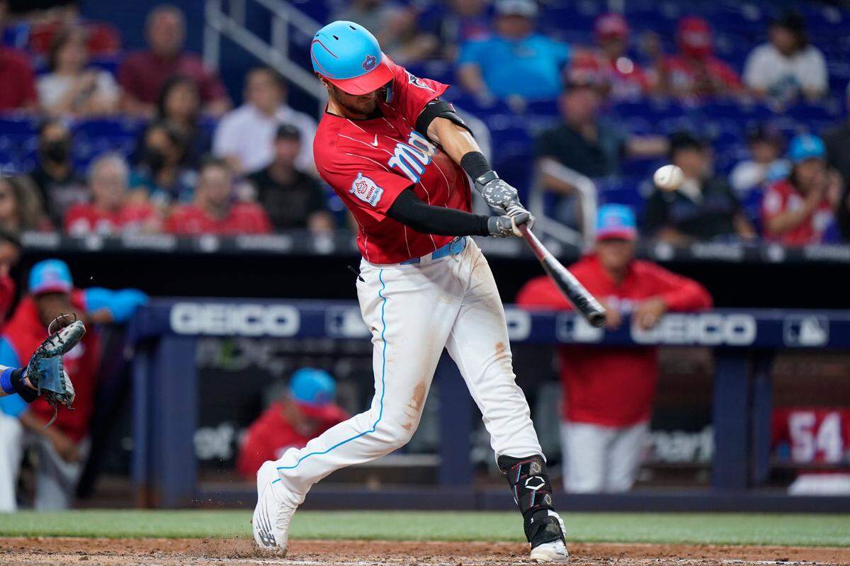 Miami Marlins’ Charles Leblanc hits a double during the eighth inning of a baseball game against the New York Mets, Saturday, July 30, 2022, in Miami. (AP Photo/Wilfredo Lee)