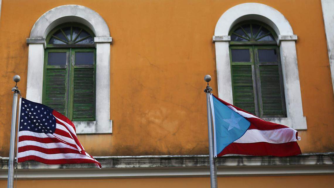 A U.S. flag flies next to the flag of Puerto Rico in Old San Juan.