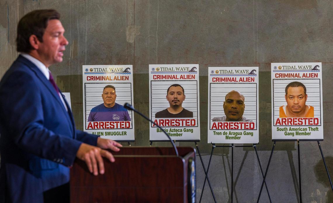 Florida Governor Ron DeSantis speaks by posters of people arrested in the Tidal Wave Operation during a press conference at the ICE-Enforcement and Removal Operation office in Miramar where he announced the results of the largest immigration operation in Florida history, a week-long joint effort with federal, state, and local law enforcement partners around the state, on Thursday May 01, 2025.