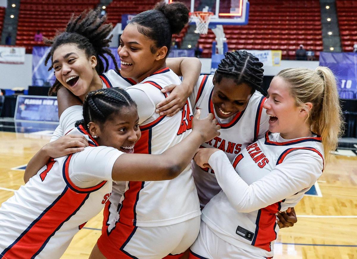 Miami Country Day players celebrate after defeating Providence School for the FHSAA Class 2A Girls High School Basketball State Championship at the RP Funding Center in Lakeland, Florida on Saturday, March 1, 2025.