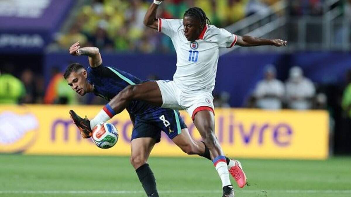 PHILADELPHIA, PENNSYLVANIA - JUNE 19:  Jean-Ricner Bellegarde #10 of Haiti competes with Bruno Guimarães #8 of Brazil for the ball during the FIFA World Cup 2026 Group C match between Brazil and Haiti at Philadelphia Stadium on June 19, 2026 in Philadelphia, Pennsylvania. (Photo by Al Bello/Getty Images)