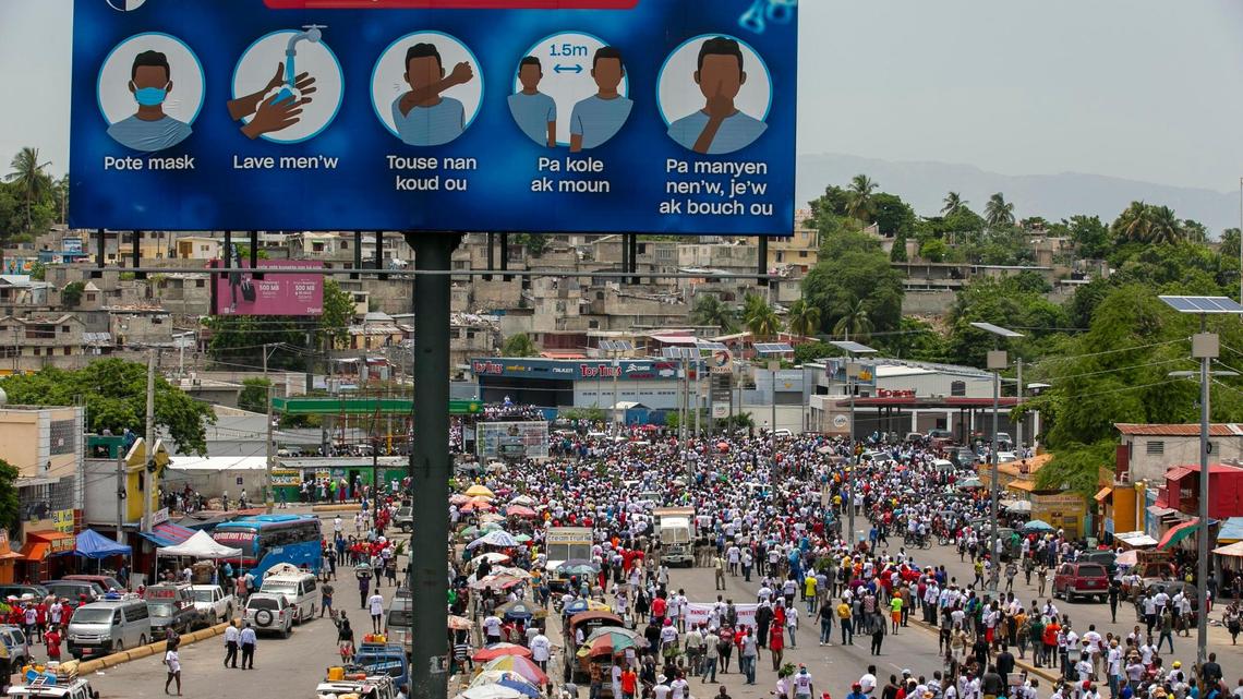 People march during a protest against gay rights in Port-au-Prince, Haiti, Sunday, July 26, 2020. The group marched demanding that President Jovenel Moise rescind his most recent decree that rewrites the 185-year-old penal code, addressing discrimination based on sexual orientation.
