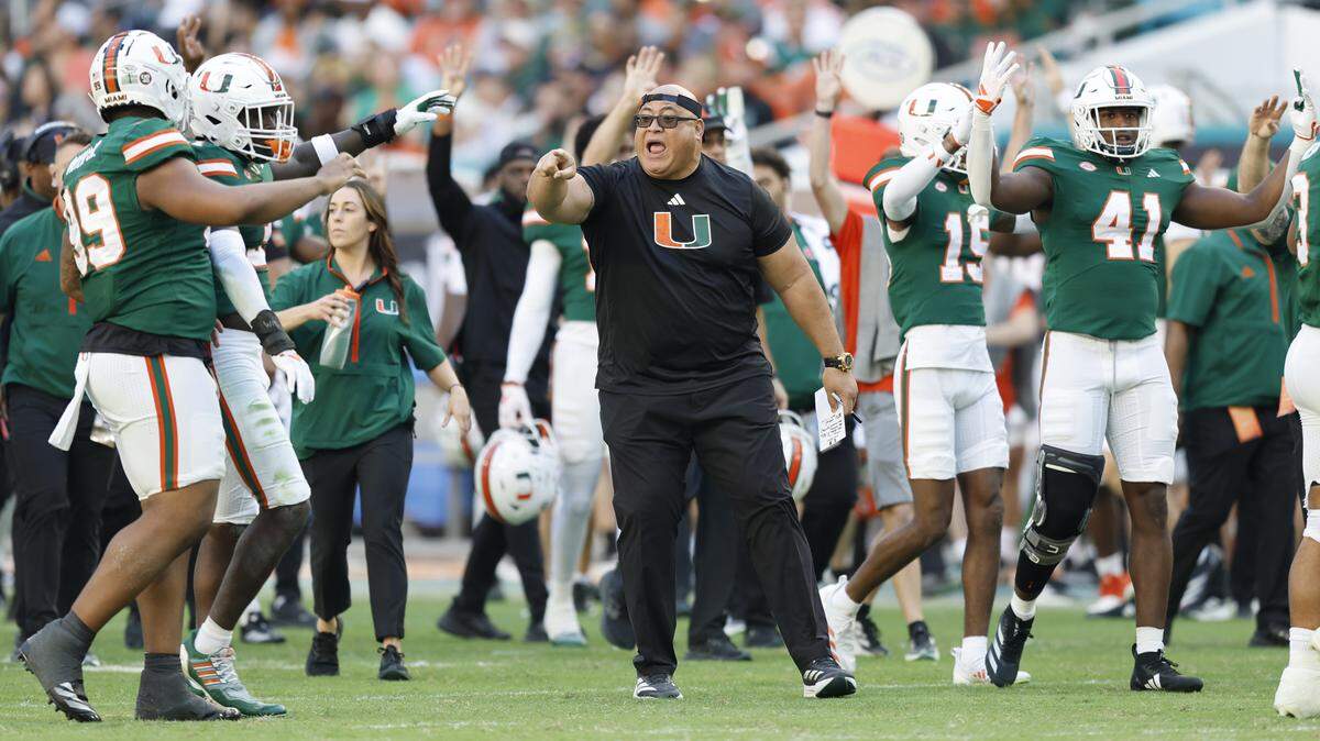 Miami Hurricanes assistant coach Joe Salave’a on the field between quarters during the game against the Wake Forest Demon Deacons in the second half of their NCAA game in Miami Gardens, Florida, on Saturday, November 23, 2024.