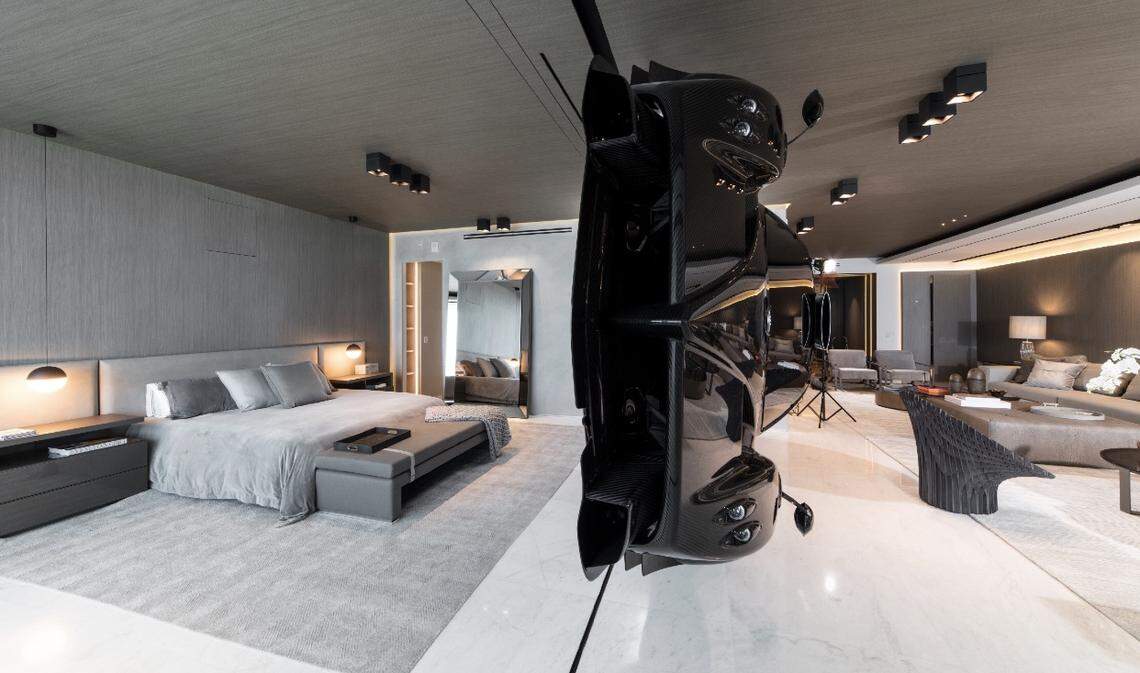 A rare $1.5 million Pagani Zonda R separates the master bedroom from the living room inside this oceanfront condo in Surfside. The owner of the condo, who is an auto enthusiast, paid a design firm to suspend the vehicle inside the unit because he says cars can be art, too.