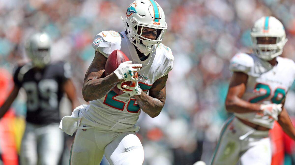 Miami Dolphins cornerback Xavien Howard (25) intercepts in the first quarter as the Miami Dolphins host the Oakland Raiders at Hard Rock Stadium in Miami Gardens on Sunday, September 23, 2018.