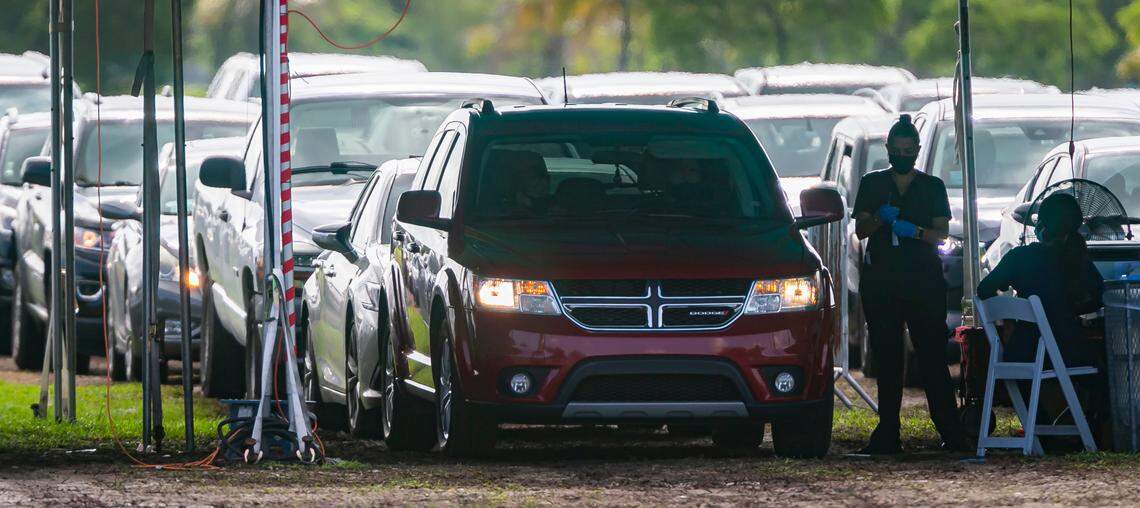 Cars line up at Amelia Earhart Park’s COVID-19 testing site in Hialeah, Florida, on Friday, July 30, 2021.