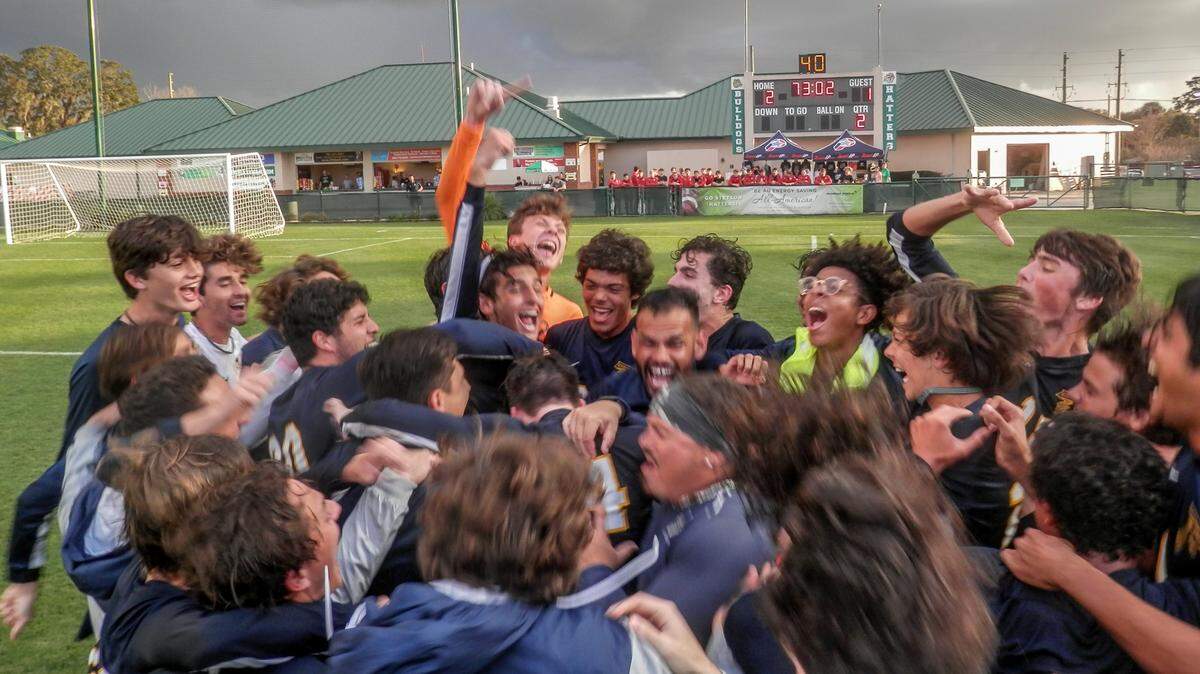 The Palmer Trinity boys’ soccer team celebrates after winning its second consecutive Class 1A state championship on Thursday, Feb. 21, 2019.