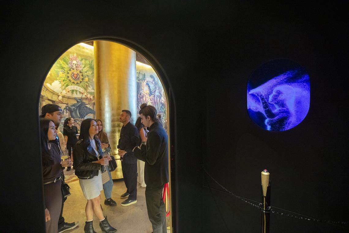 The view from inside Lyra Drake’s artwork titled Infinite Faith in a Finite World, an AI-based sculpture in the Faena hotel. Participants enter the booth and have a conversation with the AI about faith.