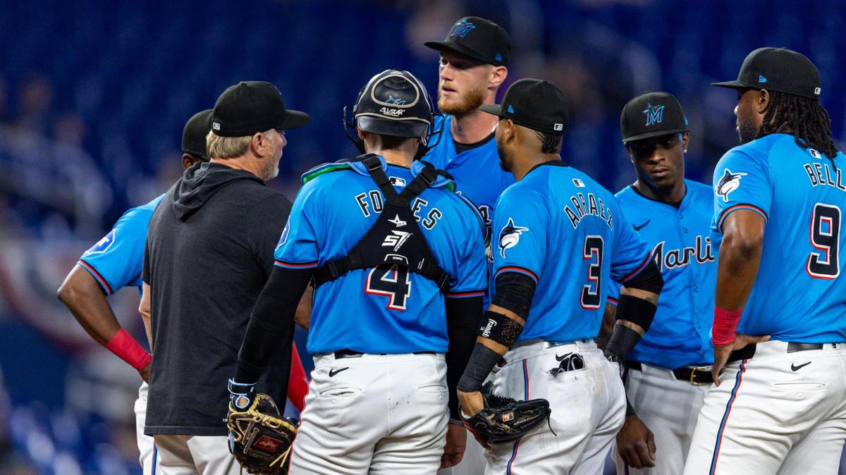Miami Marlins pitching coach Mel Stottlemyre Jr. speaks with pitcher A.J. Puk (35) during the second inning of an MLB game on opening day against the Los Angeles Angels at LoanDepot Park in Miami, Florida, on Wednesday, April 3, 2024.