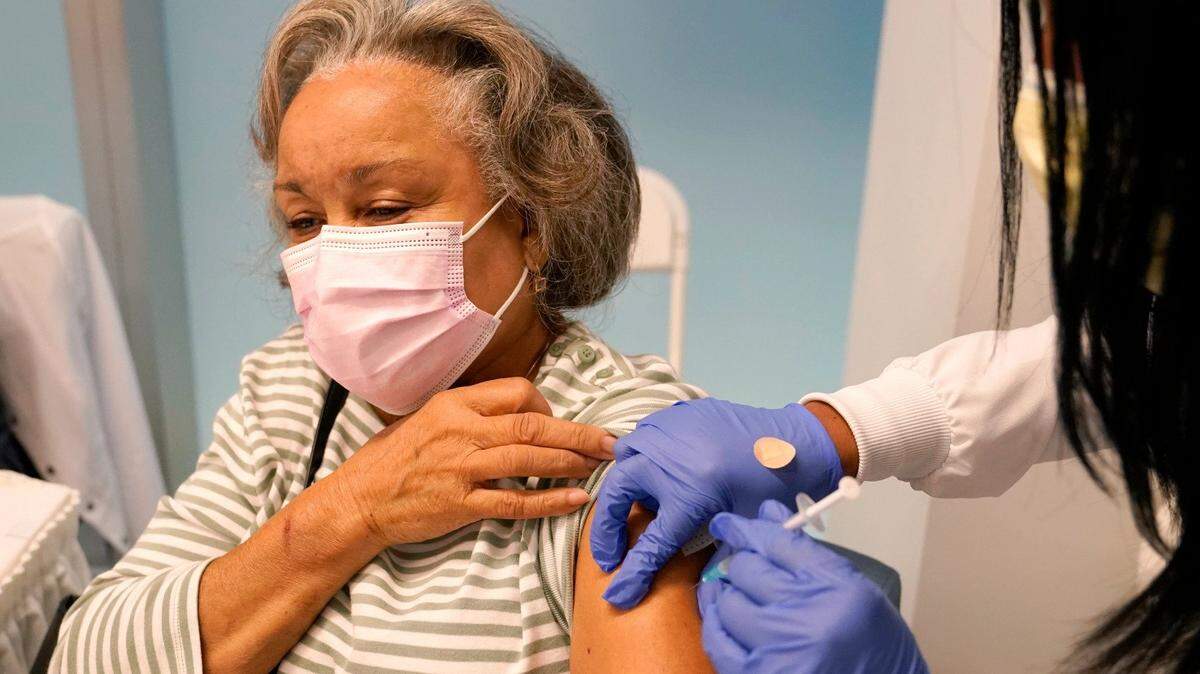 Irma Mesa, 74, receives the Pfizer-BioNTech COVID-19 vaccine at the Jackson Hospital in Miami in January.