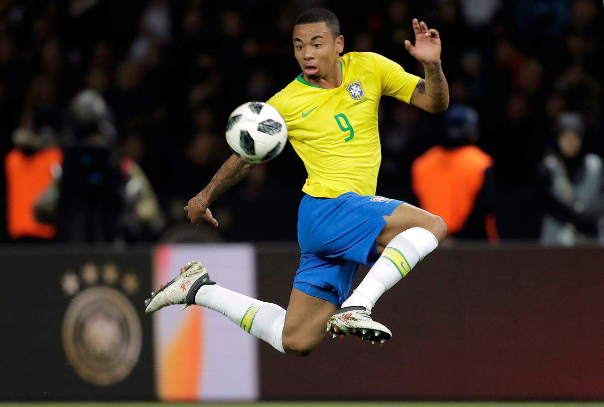 In this photo taken on Tuesday, March 27, 2018, Brazil's Gabriel Jesus controls the ball during the international friendly soccer match between Germany and Brazil in Berlin. At the World Cup four years ago, Colombia forward James Rodriguez became one of the stars of the tournament and shot to international fame with his trickery on the ball and eye for a spectacular goal. Here's a look at young players hoping to make a similar impact at this year's World Cup in Russia. Among them is France left back Benjamin Mendy, Spain midfielder Marco Asensio, Belgium winger Leroy Sane, and Brazil striker Gabriel Jesus. (AP Photo/Markus Schreiber)