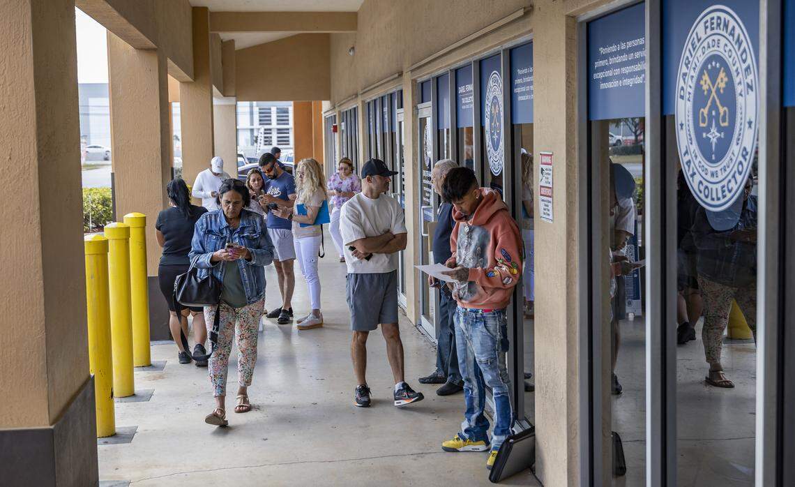People wait outside a driver license office for their appointments on Tuesday, Feb. 10, 2026, in Hialeah Gardens, Fla. As of Feb. 6, 2026, the Florida Department of Highway Safety and Motor Vehicles requires all driver license knowledge and skills examinations to be conducted exclusively in English.