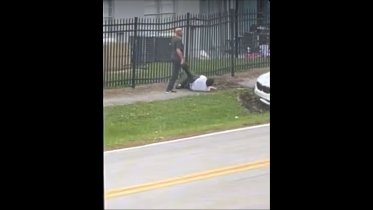 The passenger was forced at gunpoint to stay on the ground, and was struck in the head, police say.