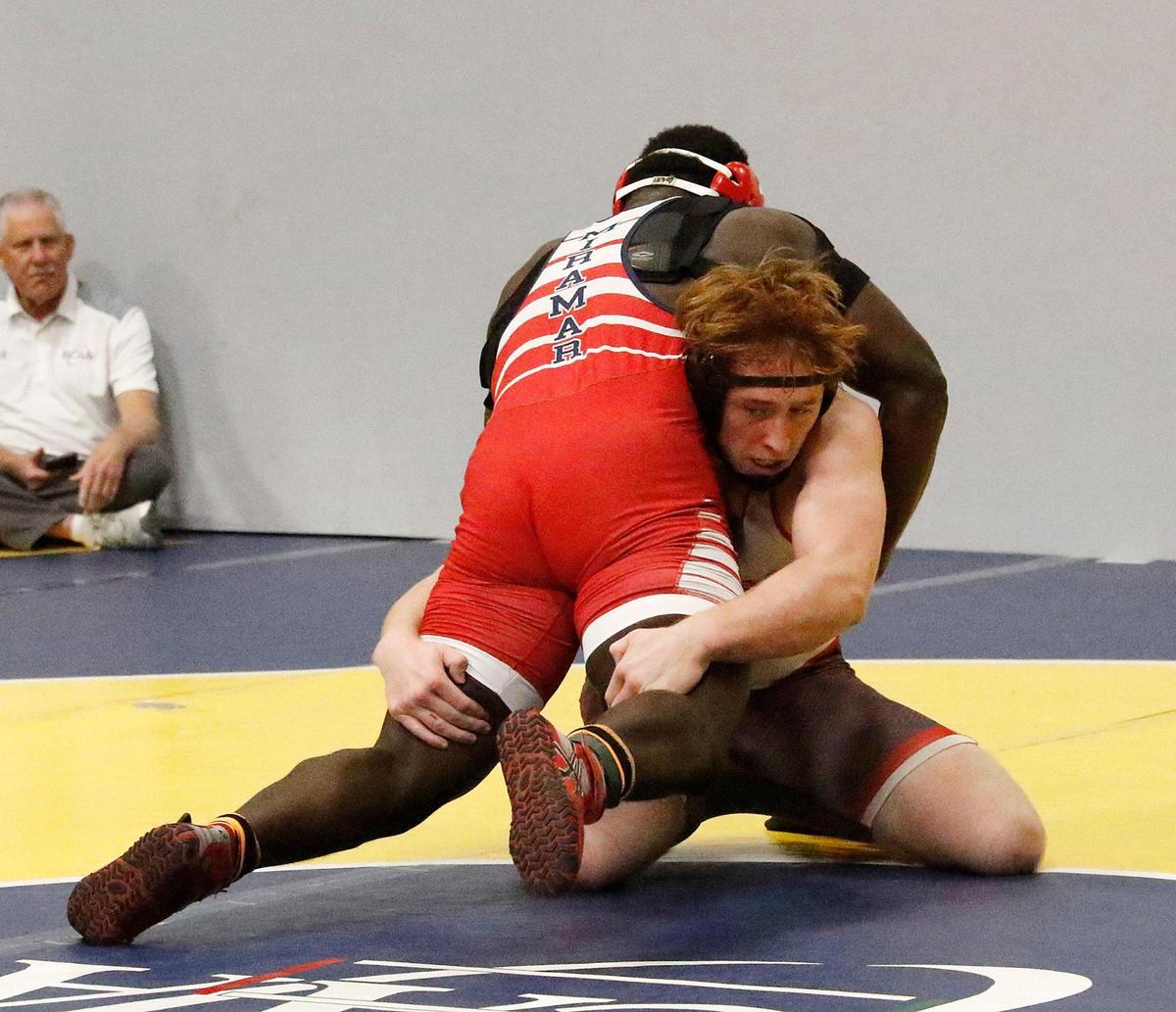 Michael Mocco, Cardinal Gibbons, wrestles Maxinot Mondesir, Miramar, during the 215-pound BCAA wrestling championship on Saturday, February 3, 2024 at Pompano Beach.