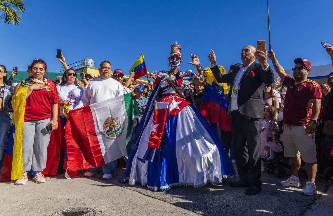 A Cuban exiled woman known as “La Mambisa” prays with a group of Venezuelan exiles living in South Florida celebrating outside of El Arepazo in Doral, Florida, after the United States attacked Venezuela and captured Venezuelan leader Nicolás Maduro,  on Jan. 3, 2026.