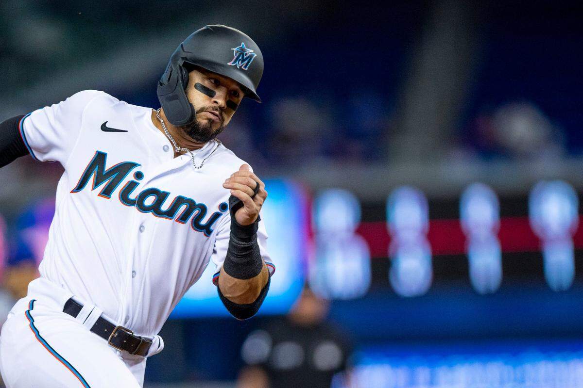 Miami Marlins base runner Eddy Alvarez (65) rounds third before scoring off a double by batter Edward Cabrera (79) during the second inning of an MLB game against the New York Mets at loanDepot park in the Little Havana neighborhood of Miami, Florida, on Tuesday, September 7, 2021.