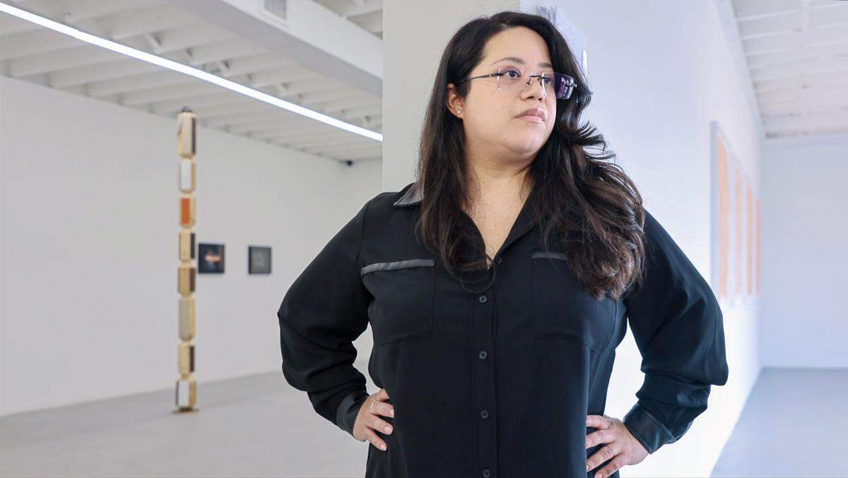Devora Perez, who is in charge of membership and operations at Dimensions Variable, understands the struggles facing local artists as they navigate earning a living and creating art.  Perez is photographed inside the gallery space of Dimensions Variable on Monday, August 4, 2025, in Miami, Florida.