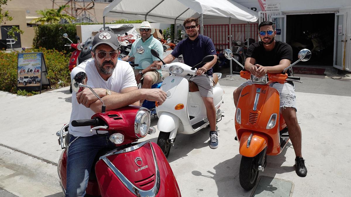 David Buzaglo (front, left) the owner of Beach Scooter Rentals on Miami Beach with (back, left to right) Jason Chute, Anthony V. Melvin and Gil Nahmani.