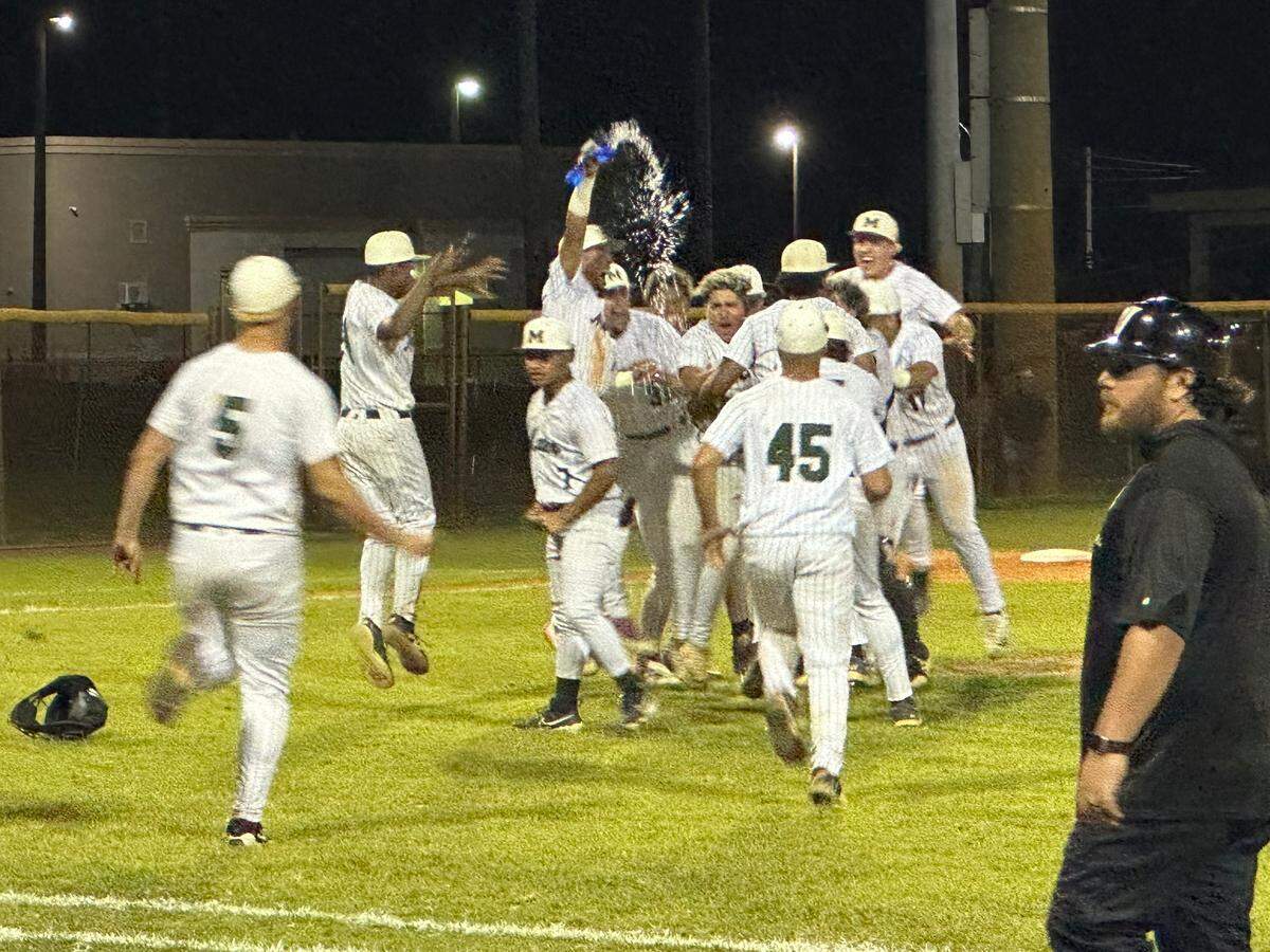 Mater Academy baseball players rush the mound following their 10-8 win over Varela on Thursday to secure a berth in the Class 5A state final four.