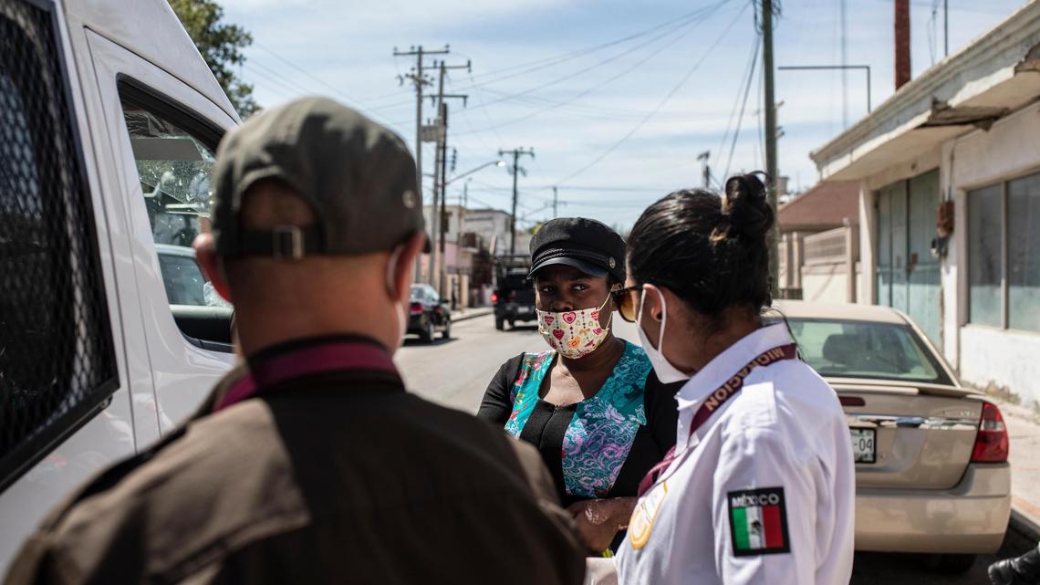 A migrant from Haiti is detained by Mexican immigration officers in Ciudad Acuña, Mexico, Wednesday, Sept. 22, 2021, near the Texas, U.S, border.