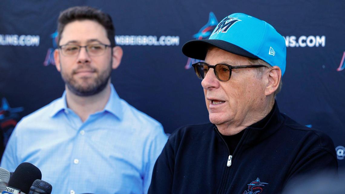 Miami Marlins Chairman and Principal Owner Bruce Sherman, at right, speaks to reporters as President of Baseball Operations Peter Bendix listens during Miami Marlins spring training at Roger Dean Chevrolet Stadium in Jupiter, Florida on Tuesday, February 20, 2024.