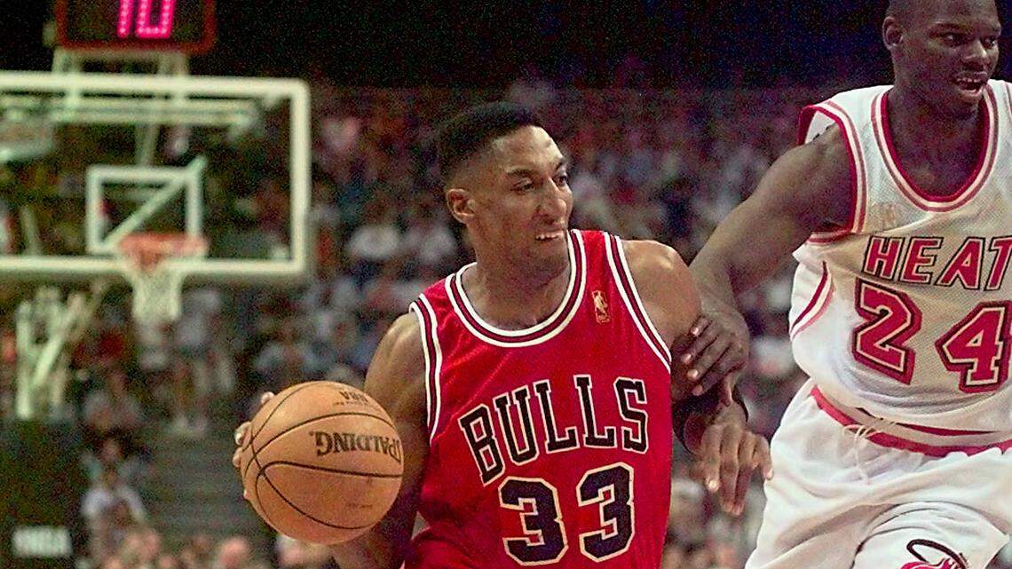 The Chicago Bulls’ Scottie Pippen drives past the Miami Heat’s Jamal Mashburn in the third game of the Eastern Conference Final in Miami on May 24, 1997.