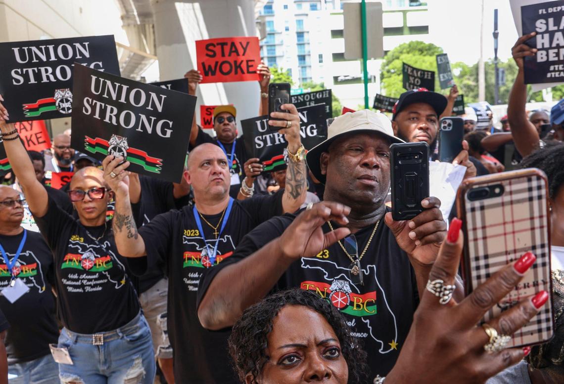Teamsters National Black Caucus listen to the words of Marvin Dunn, State Rep. Justin Pearson of TN, and others during the demonstration outside the MDCPS administration building in protest of the new African American history standards approved by the state in July, Wednesday, Aug. 16, 2023 in Miami, Florida.