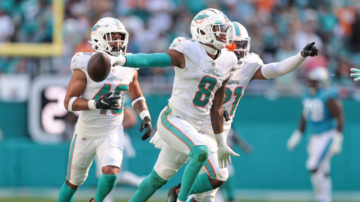 Miami Dolphins free safety Jevon Holland (8)celebrates after intercepting the ball in the second quarter during game against the Carolina Panthers at Hard Rock Stadium on Sunday, November 28, 2021.