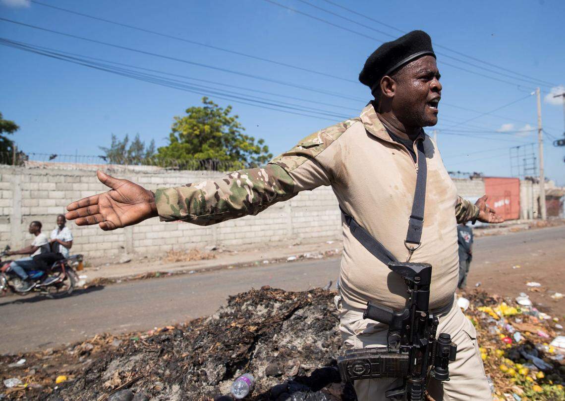 The leader of Haiti’s main armed gang, Jimmy Cherizier, speaks to the media during a tour of the La Saline neighborhood, in Port-au-Prince in 2021.