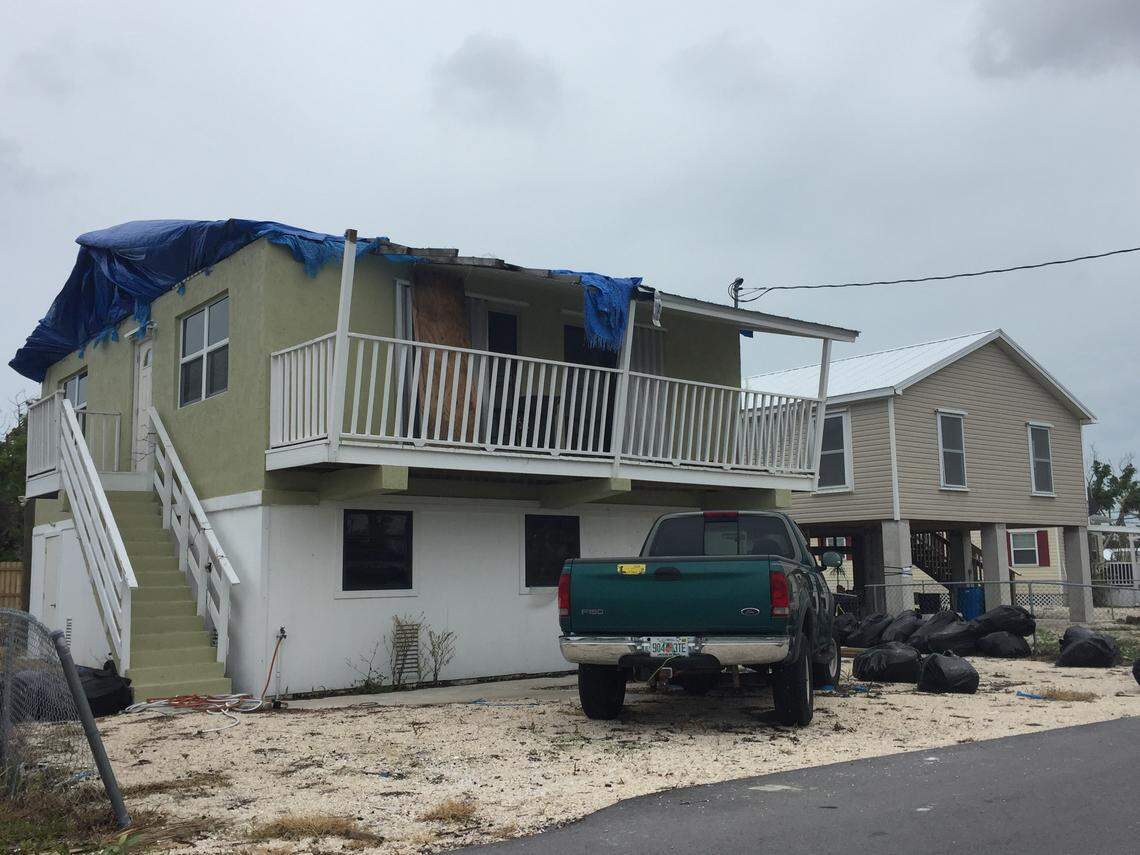 In Big Pine Key, one of the areas in the Florida Keys hardest hit by Hurricane Irma in September 2017, wrecked homes still line the roads nearly nine months later. Some still have blue tarps to cover damaged roofs.