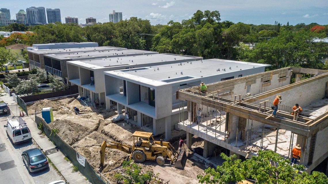 Futuristic luxury townhomes rise along Day Avenue in Miami’s historically Black West Coconut Grove on Thursday, June 16, 2022. The mostly low-income West Grove community is disappearing amid rapid residential redevelopment.