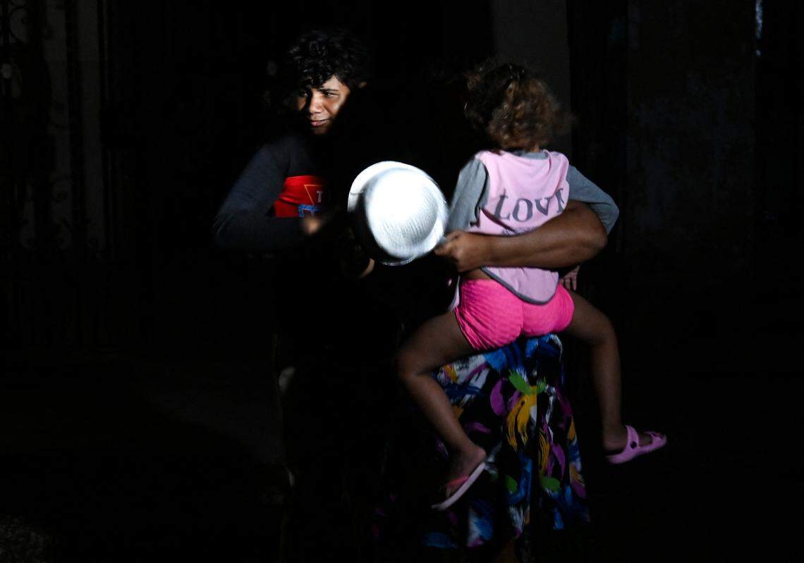 Cubans use cooking pots to demand electricity during the third night of a nationwide blackout in Havana October 20, 2024. 
