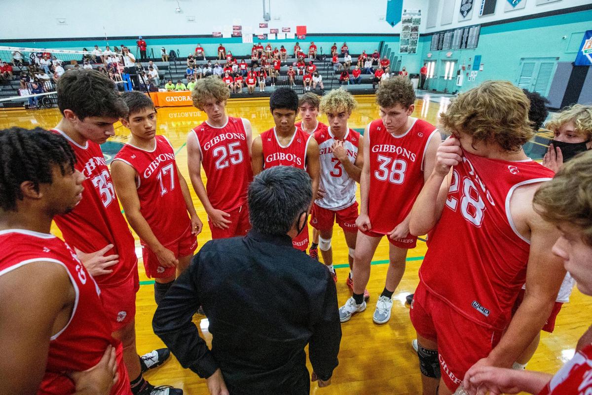Cardinal Gibbons High School Head Coach Mike Zarate speaks to his players in the middle of a timeout during the 2021 FHSAA Boys Volleyball Quarterfinals against Freedom High School at Archbishop McCarthy High School in Cooper City, Florida, on Friday, May 14, 2021. Freedom defeated Gibbons in four sets.