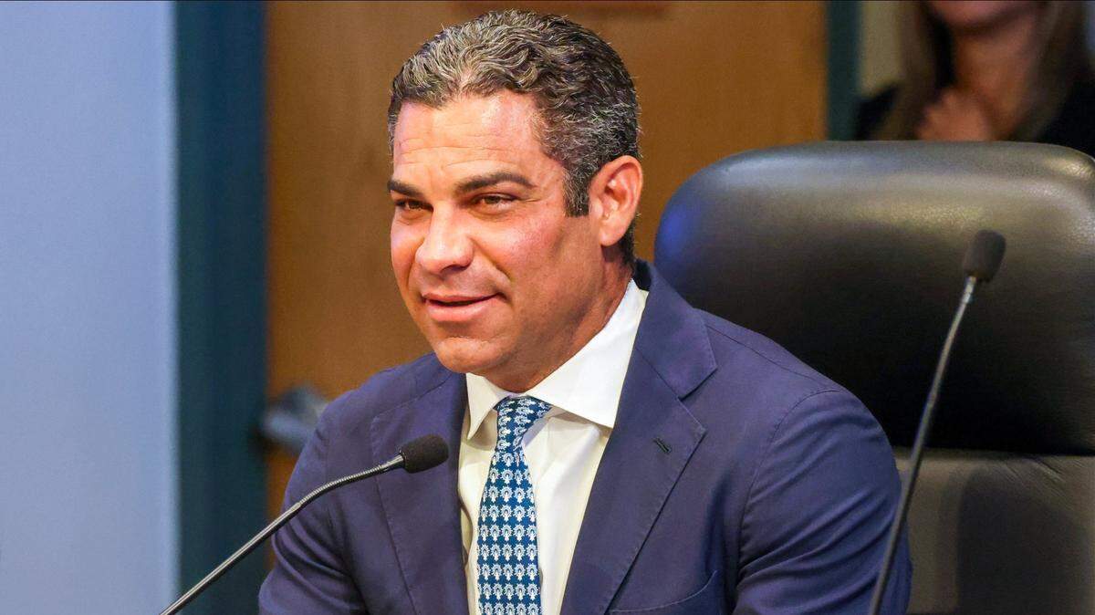 Mayor Francis Suarez smiles after being thanked for vetoing the pension plan during public comments at the City of Miami Commission meeting on Thursday, Oct. 24, 2024, at City Hall in Miami. Public comments were heard on the controversial pension plan first co-sponsored by Commissioners Miguel Angel Gabela and Christine King and later vetoed by Suarez.