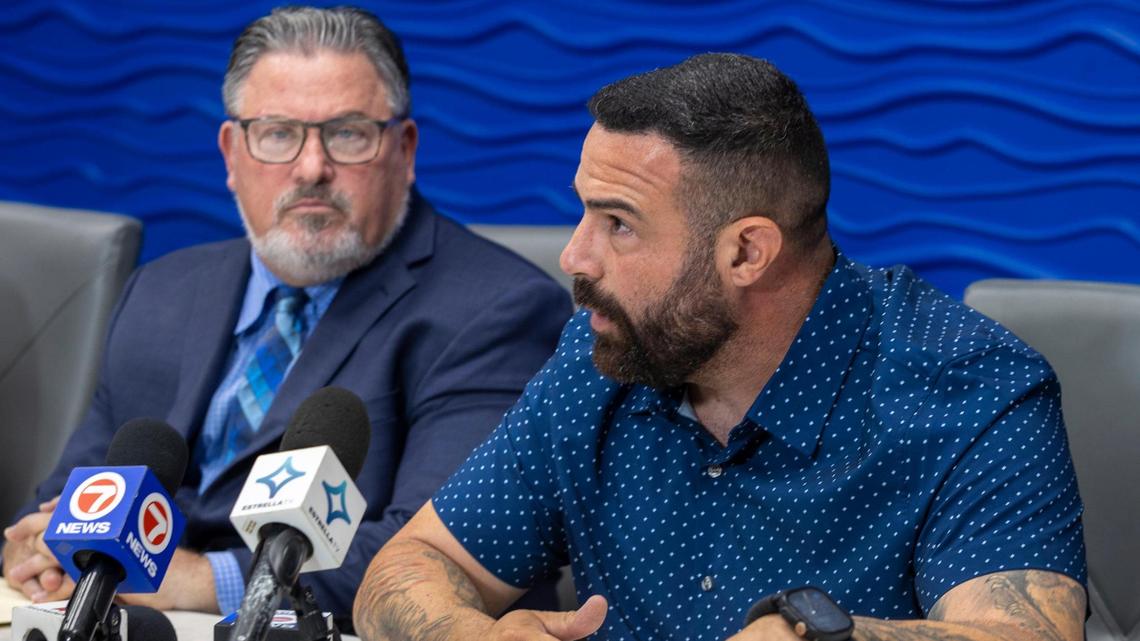 Miami Gardens police officer Juan Gonzalez says he was verbally assaulted by others within the department. His attorney, Michael Pizzi, is to his left at a press conference in Pizzi’s office on Wednesday, July 16, 2025, in Miami Lakes, Florida.