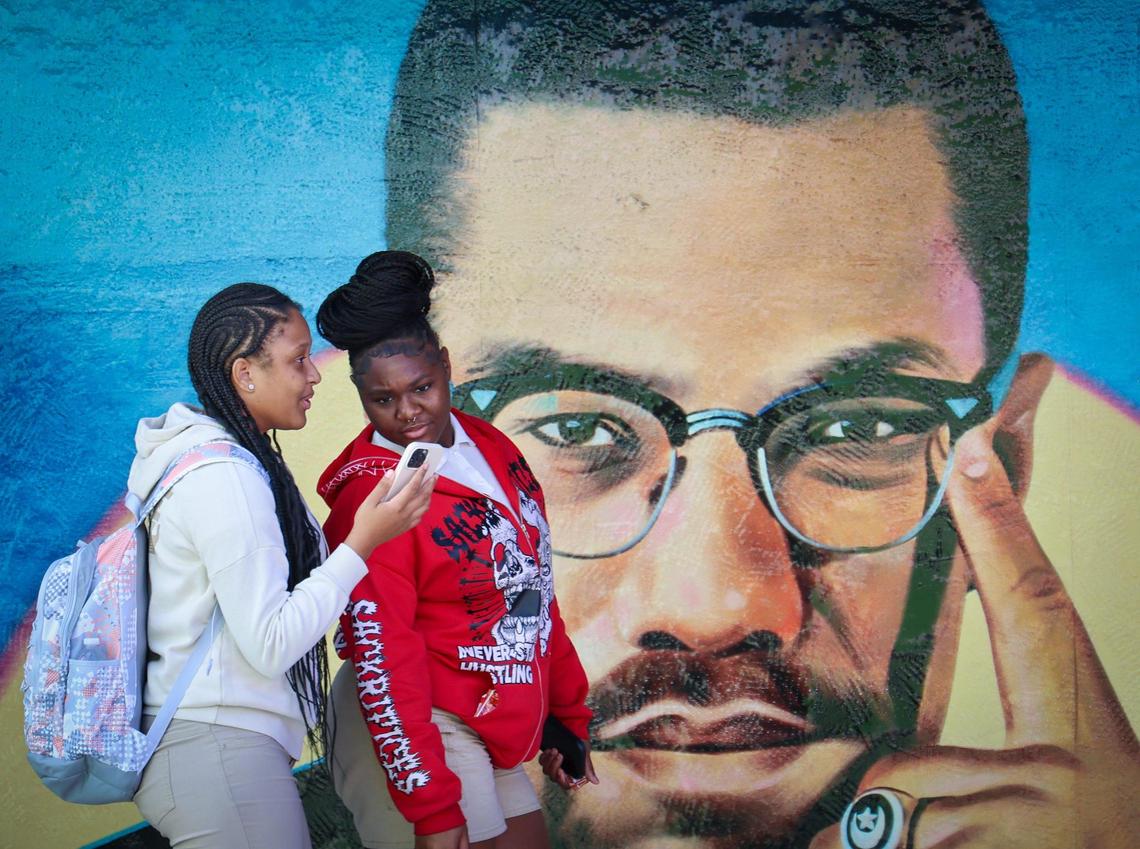 Miami Northwest High School students Cheyenne Row, 18, left, and Amirra Cobb, 18, make their way to the auditorium at the Marshall L. Davis African Heritage Cultural Arts Center for a Black History Month event.