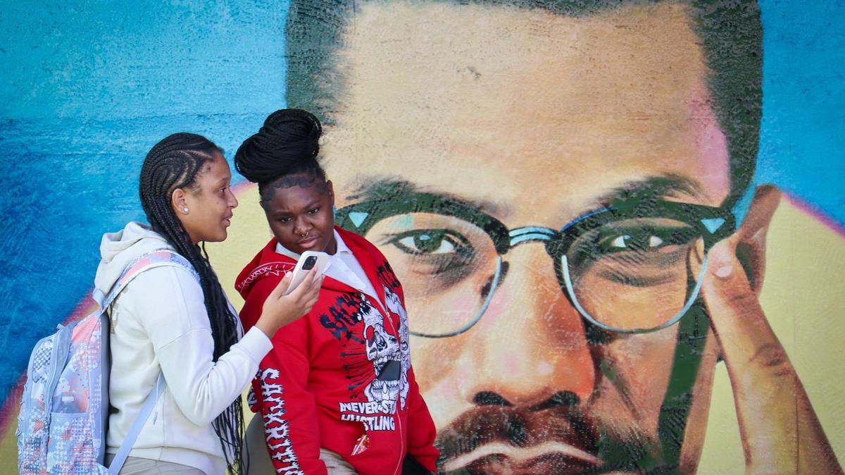 Miami Northwest High School students Cheyenne Row, 18, left, and Amirra Cobb, 18, make their way to the auditorium as the Marshall L. Davis African Heritage Cultural Arts Center presented its Black History Month event for 120 students from Miami-Dade County Public Schools on Monday, Feb. 10, 2025.
