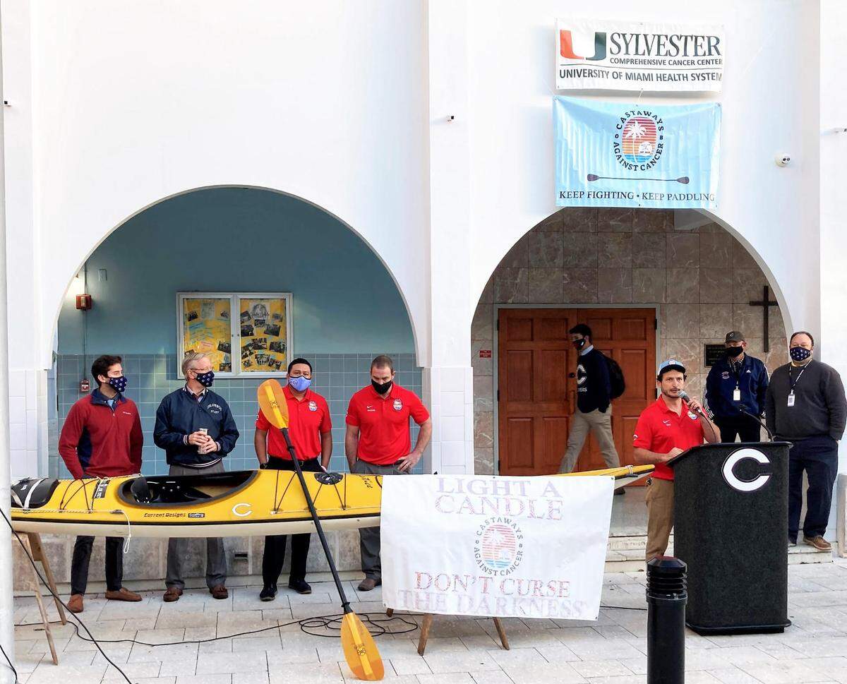Christopher Columbus High School teachers, alumni, and members of the Castaways Against Cancer kayaking team including Javier Hermedia, Adam Scholer, Jose Mendoza, Paul Kumer and team captain and Columbus teacher Eric Pino at the podium, gather for World Cancer Day Feb. 4.