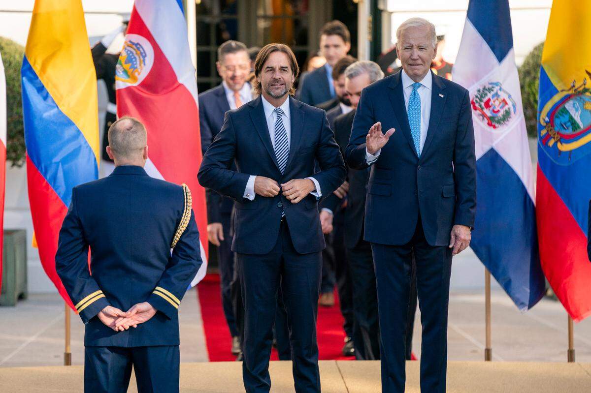 U.S. President Joe Biden, right, and President Luis Lacalle Pou of of Uruguay, left, arrive for the family photo at the inaugural Americas Partnership for Economic Prosperity Leaders Summit on the South Portico of the White House in Washington, DC, USA, on Friday, November 3, 2023. The summit is aimed to deepen the mutual benefit in trade, manufacturing, immigration and other sectors among the Western Hemisphere nations.