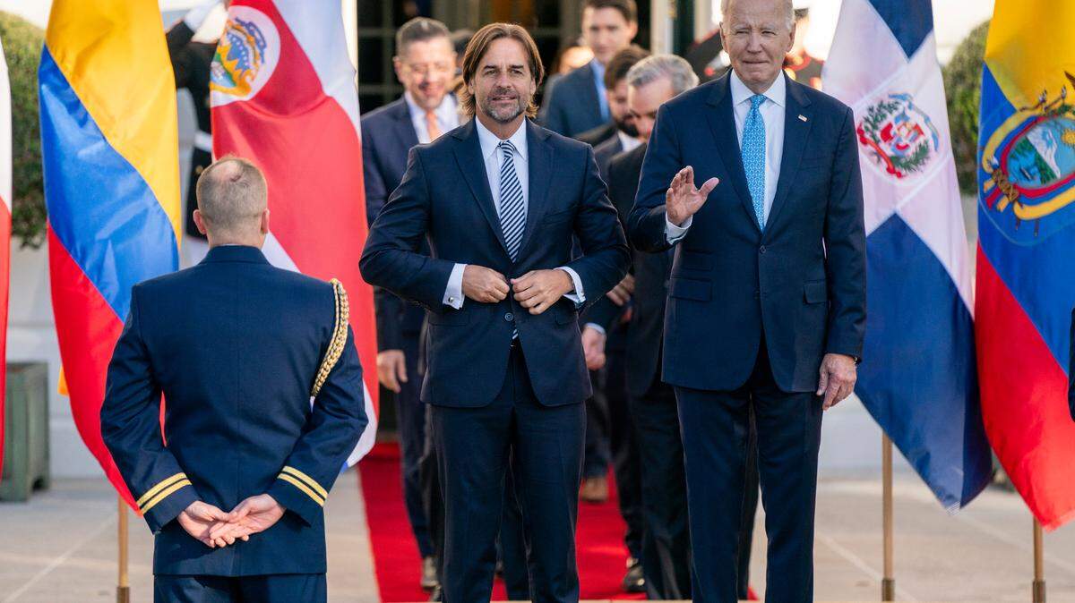 U.S. President Joe Biden, right, and President Luis Lacalle Pou of of Uruguay, left, arrive for the family photo at the inaugural Americas Partnership for Economic Prosperity Leaders Summit at the White House, Nov. 3, 2023.