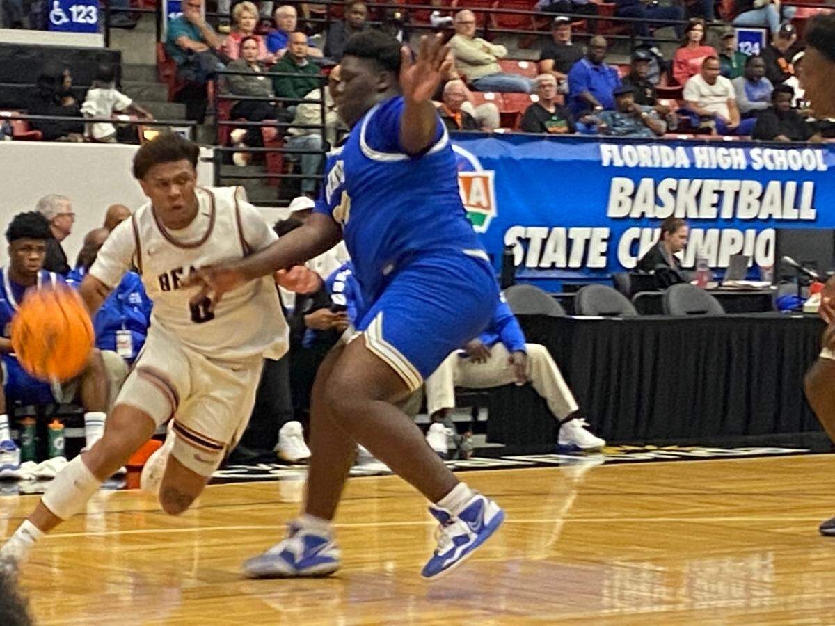 Mater Lakes’ Michael Bradley tries to drive around St. Petersburg Gibbs’ Marcus Calvin during Thursday’s Class 4A state boys’ basketball semifinal win over St. Petersburg Gibbs at the RP Funding Center in Lakeland, Fla.