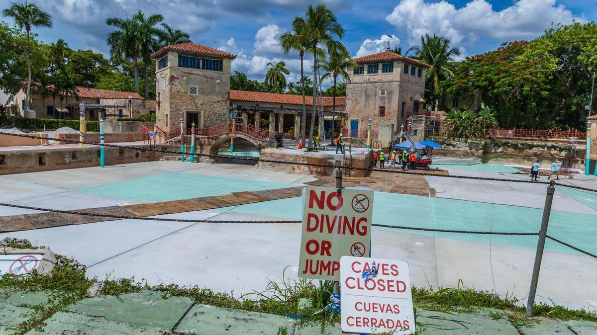 Workers are seen at the Venetian Pool in Coral Gables, which is currently undergoing renovations, on Tuesday, July 22, 2025. The pool has been closed to the public since October.