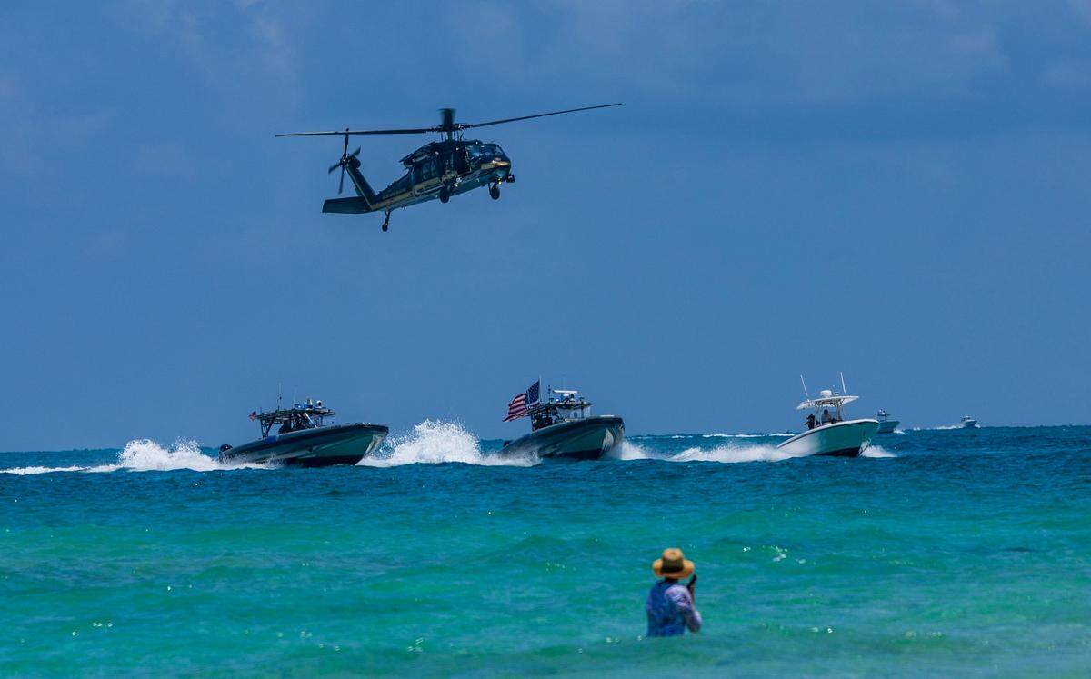 U.S. Customs and Border Protection vessels and a helicopter conduct an interdiction demonstration off South Beach during the Hyundai Air & Sea Show, part of Miami Beach’s annual National Salute to America’s Heroes, on Saturday, May 24, 2025.