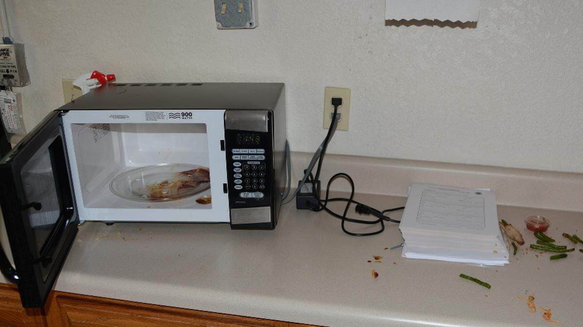 The way two Boynton Beach police officers found the eating area of the Congress Avenue substation after someone microwaved and ate the chicken part of a chicken and asparagus dish