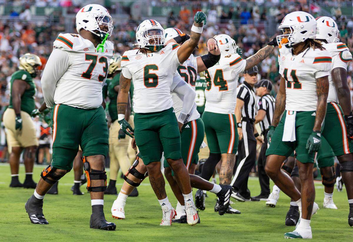 Miami Hurricanes running back Damien Martinez (6) celebrates after scoring a touchdown against the South Florida Bulls in the first half of their NCAA college football game at the Raymond James Stadium on Saturday, Sept. 21, 2024, in Tampa, Fla.