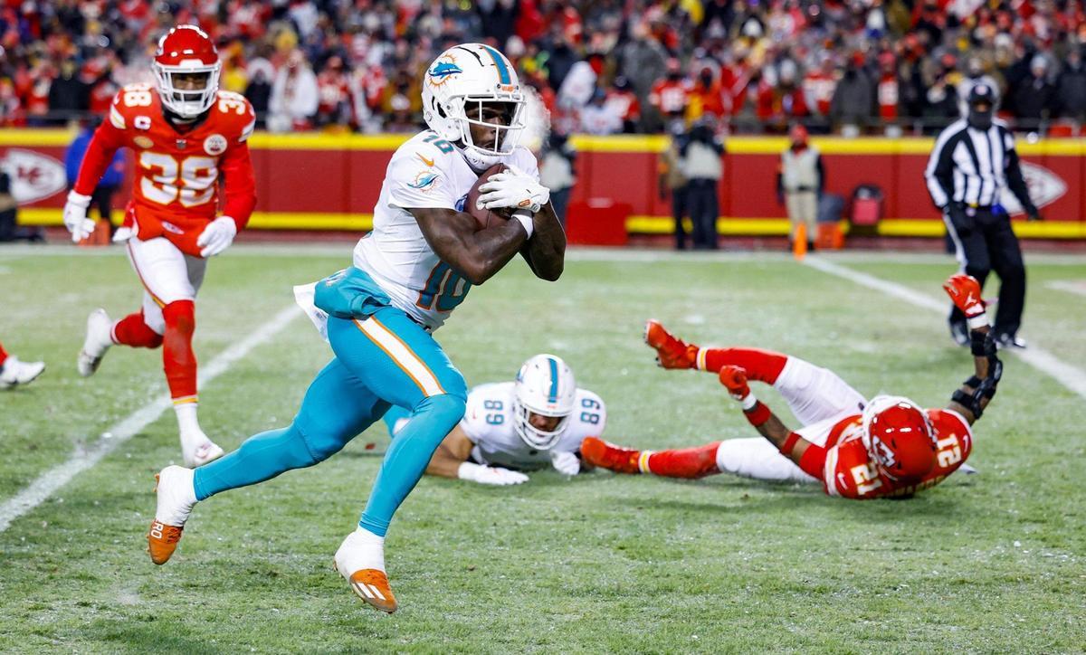 Miami Dolphins wide receiver Tyreek Hill (10) scores in the second quarter against the Kansas City Chiefs at GEHA Field at Arrowhead Stadium in Kansas City, Missouri, on Saturday, January 13, 2024.