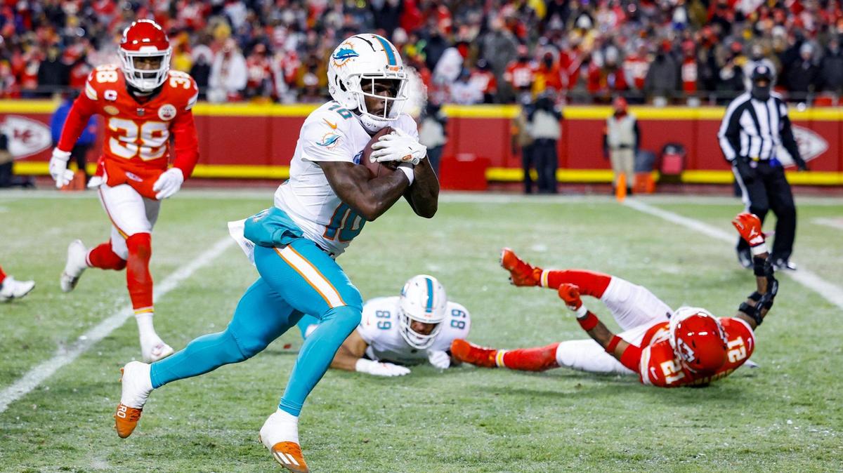 Miami Dolphins wide receiver Tyreek Hill (10) scores in the second quarter against the Kansas City Chiefs at GEHA Field at Arrowhead Stadium in Kansas City, Missouri, on Saturday, January 13, 2024.